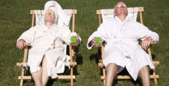 A mature couple detoxing during a do it yourself spa day in their backyard