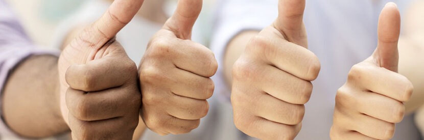 Four hands giving thumbs up in a row