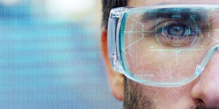 A close up of a mans face wearing goggles with data overlayed to represent the advantages of analytics in assisted living