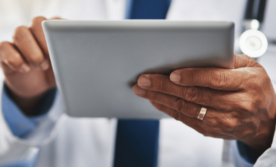 Practitioner Engagement product page feature img close up hands on tablet