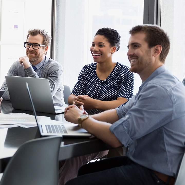 A group of people reviewing financial information in the PointClickCare software