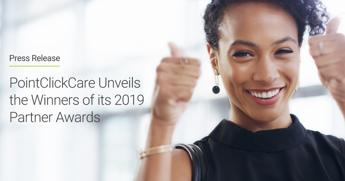 PointClickCare Unveils the Winners of its 2019 Partner Awards at its Amplify Partner Conference. Photo of a woman smiling and giving two thumbs up.