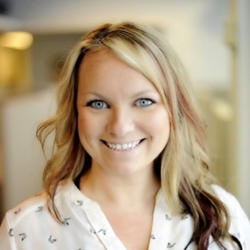 Female PointClickCare employee smiling for a headshot