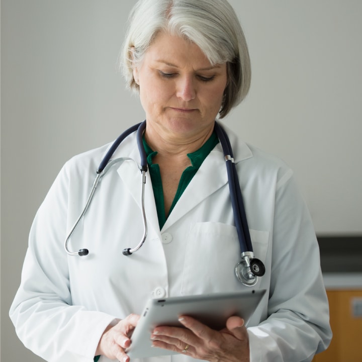 Hospital physician looking at reports