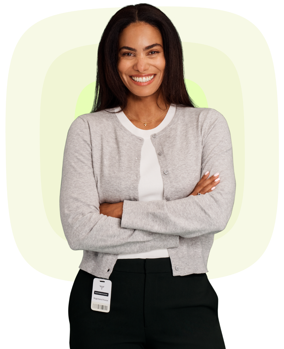 Registered nurse confidently using healthcare software to improve patient care and workflow efficiency.